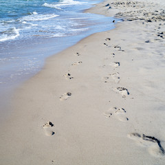 Footprints on the beach of the Polish Baltic Sea coast near Rewal