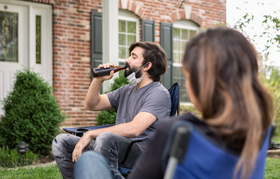 Distanced: Man Pulls Down Face Mask To Drink Beer