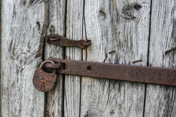 old vintage lock on a wooden door