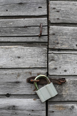 old vintage lock on a wooden door