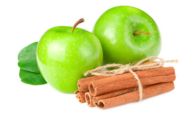 green apples with green leaves and cinnamon isolated on white background
