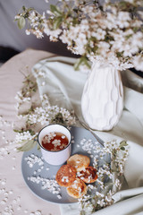 spring healthy Breakfast fried cheesecakes, against a blooming bouquet flowers