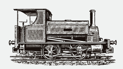 Historical saddle tank four-wheel locomotive in side view