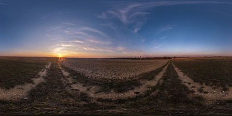Fototapeta na wymiar full seamless spherical hdri panorama 360 degrees angle view among fields in evening sunset with awesome blue pink red clouds in equirectangular projection, ready for VR AR virtual reality
