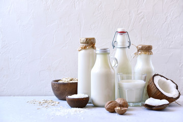 Alternative types of vegan milks in glass bottles.