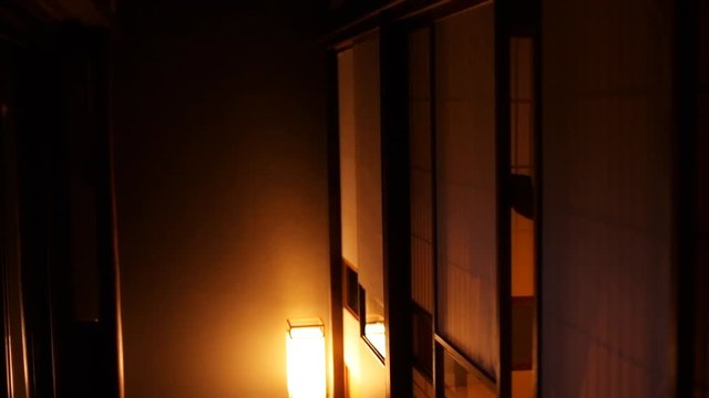 Slow Motion Of Japanese Ryokan Traditional House With Man In Kimono Yukata Walking Through Shoji Sliding Paper Doors And Tatami Mat Floor Handheld