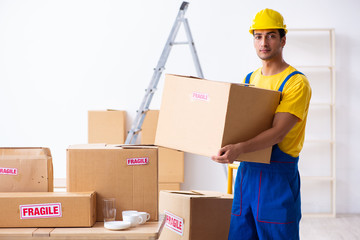 Young male professional mover doing home relocation