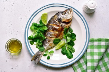 Grilled dorado or sea bream. Top view with copy space.