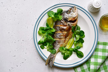 Grilled dorado or sea bream. Top view with copy space.