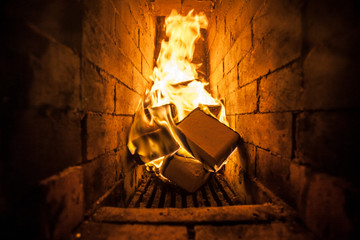 Blazing fire in a stone stove. Burning flame.