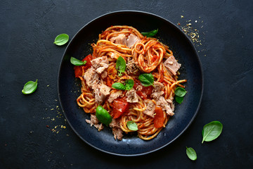 Pasta spaggeti with tuna and tomato sauce. Top view with copy space.
