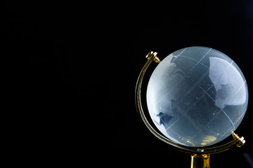 Glass globe on a black matte background