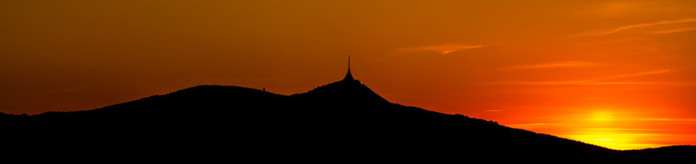 Silhouette of Jested mountain at sunset time, Liberec, Czech Republic. Panoramic shot
