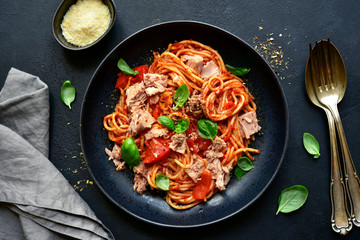 Pasta spaggeti with tuna and tomato sauce. Top view with copy space.