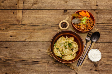 Dumplings stuffed stewed cabbage and sour cream. Traditional Ukrainian dish varenyky