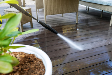 What Kind of Brush Is Good for Composite Wood Decking? | cleaning Composite Wood Decking planks with high pressure washer