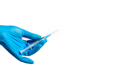 Hands in medical gloves hold a syringe with medicine on a white background