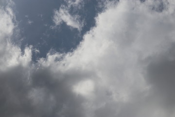 Dark Storm Clouds with Light Sky Breaking Through Corner — Dramatic Weather Background