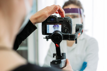 Shooting in the hospital of medical worker in coronavirus protection suit.