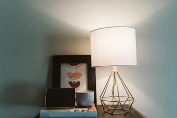 Lamp, Picture Frame, Candle on Table in Living Room Apartment