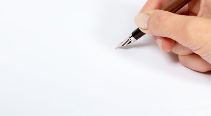 Fountain pen with silver tip in hand