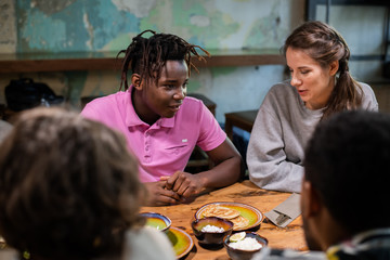 Close up of highschool students having a snack in a modern cafe