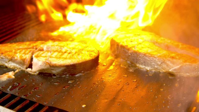 Fish cuts being grilled with fire