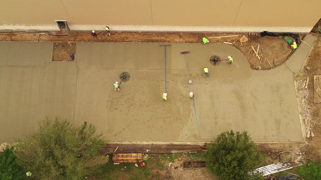 Construction Workers Finishing Concrete Pavement, Bryan, Texas, USA