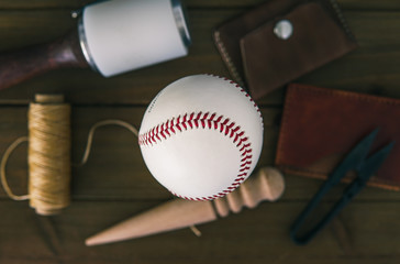 Leather baseball with leather making tools