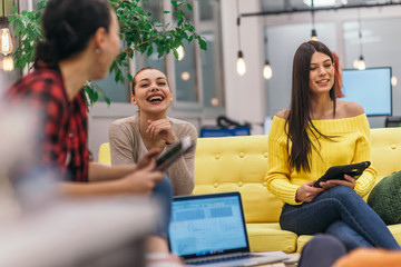 Multiethnic group of employees working in a google environment company. Group of colleagues working on a project in modern offices
