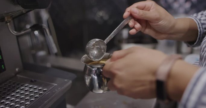 Woman preparing cuban coffee