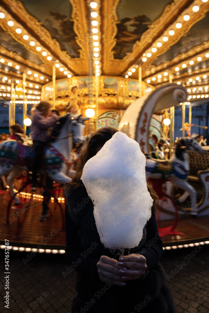 Wall mural A cotton candy in front of an ancient German Horse Carousel built in 1896 in Navona Square, Rome, Italy