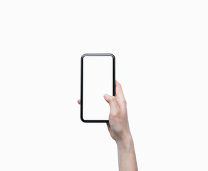 Close-up of hand holding black smartphone isolated on white background.