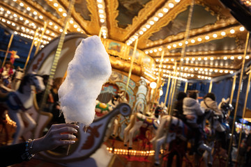 A cotton candy in front of an ancient German Horse Carousel built in 1896 in Navona Square, Rome, Italy