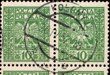 Kołomyja. Kasownik / datownik pocztowy (1932) odbity na znaczkach pocztowych z godłem państwowym na tle jednolitym między pionowymi ornamentami (10 gr, Fi.243).