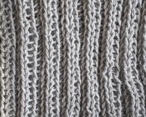 Knitted texture of gray color knitted on knitting needles with two on two elastic band