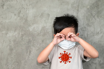A boy wearing medical face mask for pollution or coronavirus,child itchy eyes and nose, Kid scratching nose while wearing protection mask.Protection against contagious disease, coronavirus.