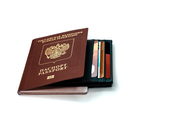 A credit cardholder next to a foreign passport. Payment of tickets for travel.