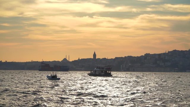 ISTANBUL, TURKEY, May 23rd 2018: The ship is sailing along the Bosphorus at sunset on the background of the Galata tower. Part2