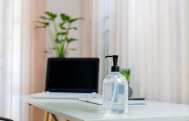 Hand sanitizer alcohol gel pump bottle on the table in office, Health care and COVID-19 Coronavirus concept