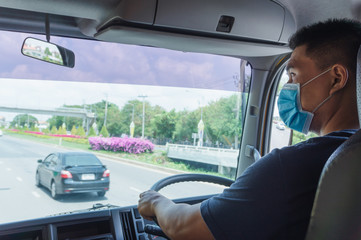 Truck driver wearing a mask