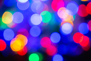 Colorful abstract blurred circular bokeh light of night city street for background. graphic design and website template design.