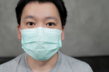 Man wearing hygienic mask to prevent infection, airborne respiratory illness such as flu, 2019-nCoV.Protection against contagious disease, coronavirus.