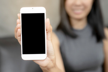 Women was show smart phones. The mobile has a black space for your pictures and text, destination technology and people concept.