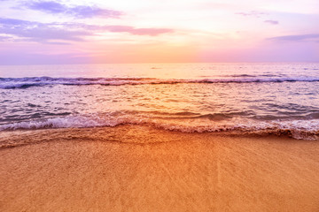 Obraz premium Beautiful sunset at the beach, relaxing by the sea, summer holiday, nature background, tropical weather