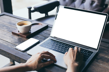 computer,cell phone mockup image blank screen with white background for advertising,hand woman work using laptop texting mobile contact business search information on desk in cafe.marketing,design