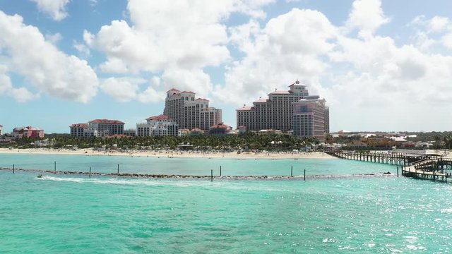 Bahamas, Nassau. Tilt Up Drone Aerial View of Waterfront, Luxury All Inclusive Resorts and Turquoise Water of Atlantic Ocean