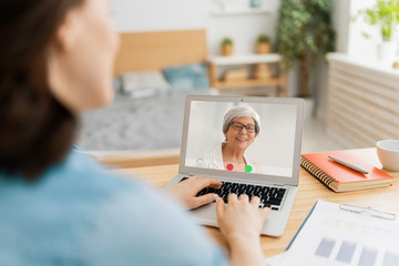 Young woman is chatting with mother.