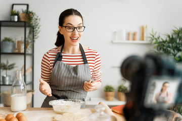 woman is recording vlog about cooking.