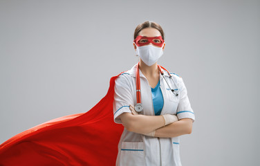 Doctor wearing facemask and superhero cape © Konstantin Yuganov